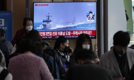 A TV screen in Seoul shows an image of a South Korean navy vessel as its military fired warning shots at a North Korean ship before dawn on Monday.