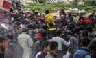 ‘Death at any moment’: fights break out as Gazans compete over airdropped aid