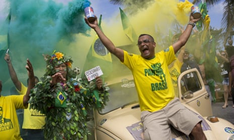 Supporters of presidential front-runner Jair Bolsonaro sing the national anthem outside his residence in Rio de Janeiro.