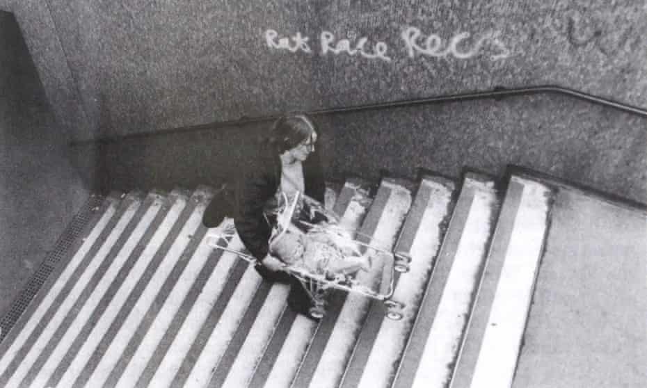 A daily struggle … Matrix founding member Anne Thorne carries a pushchair up the steps of a subway in Aldgate, east London.