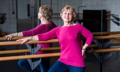 Rachel Thompson dressed in a bright pink top and blue leggings in a rehearsal suite.