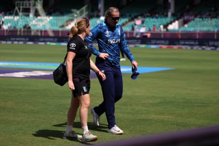 Sophie Ecclestone walks off the pitch with medical staff during the match and is now a doubt for the semi-final clash with South Africa.