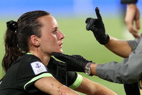 Australia's Hayley Raso gets medical attention during the match against Iran.
