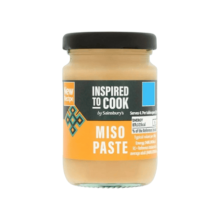A jar of Sainsbury's miso paste with a dark lid and orange label