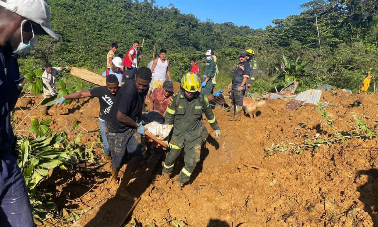 Emergency workers at the scene of a mudslide in western Colombia that killed at least 34 people. Photograph: Anadolu/Getty Images