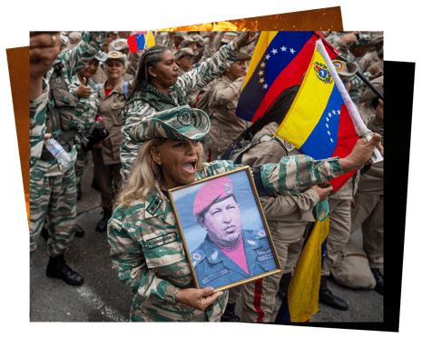 A person holds an image of the late Venezuelan president Hugo Chávez during a march to commemorate National Dignity Day in Caracas