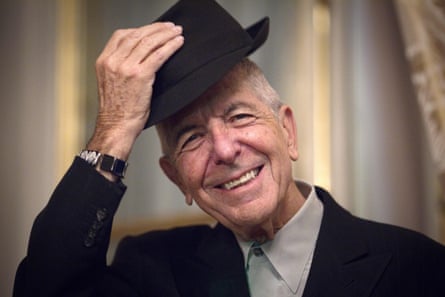 He lifts his hat, smiling