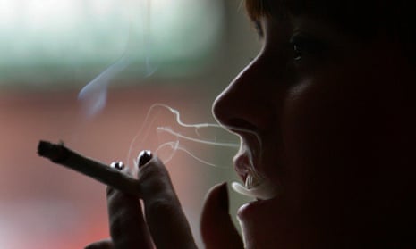 A woman smoking marijuana.