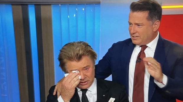 Karl Stefanovic puts his arm around Richard Wilkins as he pays tribute to Olivia Newton-John on live television.