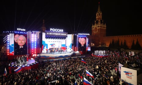 Russian President Vladimir Putin attends a rally marking the 10th anniversary of Russia's annexation of Crimea from Ukraine in Red Square, central Moscow.