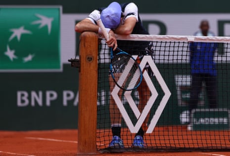 Australia’s Jordan Thompson rests his head on his forearms and ponder how another point has just gone begging against Rafael Nadal at the French Open.