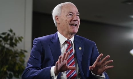 Arkansas Governor Asa Hutchinson gestures during an interview with the Associated Press in December in Washington.