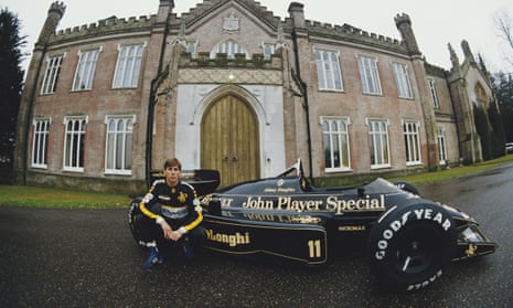 Johnny Dumfries posing with a Lotus-Renault 98T turbo outside Ketteringham Hall in Norfolk in 1986.