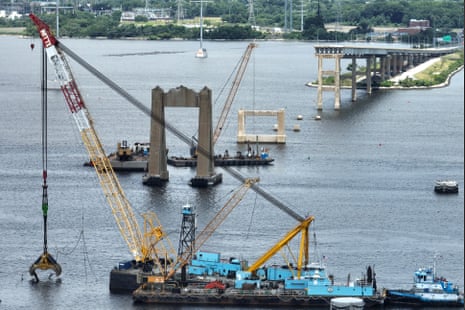 In an aerial view, salvage crews continue to clean up wreckage from the collapse of the Francis Scott Key Bridge in the Patapsco River on June 11, 2024 in Baltimore, Maryland.