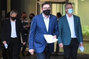 Victorian premier Daniel Andrews (centre), Victorian chief Health officer Brett Sutton (left) and Victorian health minister Martin Foley arrive to a press conference on Sunday.