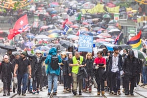 Protesters march in the central business district of Melbourne, Australia, against new vaccine mandates.