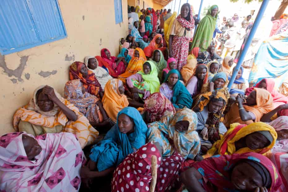 Women forced from their homes by conflict at a makeshift medical centre in Kutum, in the Sudanese state of North Darfur