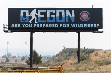 A billboard reading 'Oregon: are you prepared for wildfires' stands on the side of Highway 26 in Madras, Oregon.