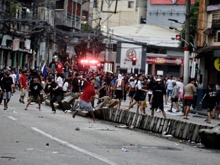 People on the streets and crash barriers