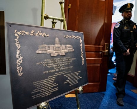 A photograph of a plaque honoring the police who defended the US Capitol on January 6 is seen outside a hearing on the five year anniversary of the riots, 6 January 2026.