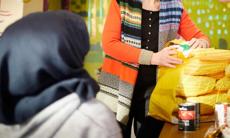 Volunteers giving food parcels to asylum seekers in Bradford
