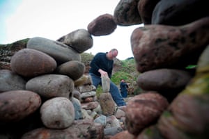 Work begins at the stone stacking competition.