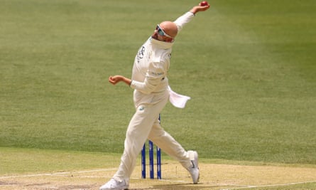 Nathan Lyon bowls on day three of the first Test against Pakistan at Perth Stadium.