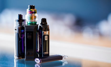 Vaping products stand on a vape store counter