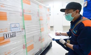 Workers register boxes containing coronavirus vaccines made by Chinese company Sinovac, after arriving at a facility of state-owned pharmaceutical company Bio Farma in Bandung, West Java, Indonesia, Monday, 7 December 7, 2020.