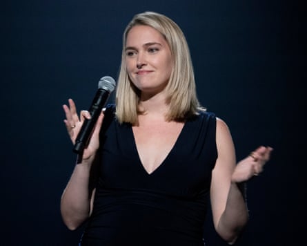 Jena Friedman gesticulating while performing standup