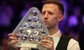 Judd Trump of England celebrates with the Paul Hunter trophy after his 10-8 victory over Mark Williams in the Masters final.