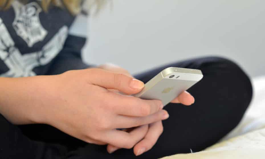 A young person using a mobile phone