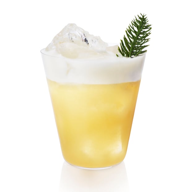 Spruced up: Pine's Evergreen Sour. An amber drink with a white, foamy top and a spring of pine in it.