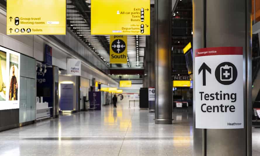 Sign for a Covid-19 testing centre at the Heathrow international arrivals hall this January