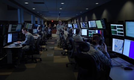 Analysts working in the top-secret SCIF room (Sensitive Compartmented Information Facility) at McConnell Air Force Base in Wichita.
