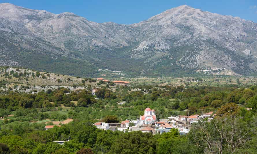 View from wooded hillside to the village of Mesa Lasithi, near Tzermiadoon the Lasithi plateau.