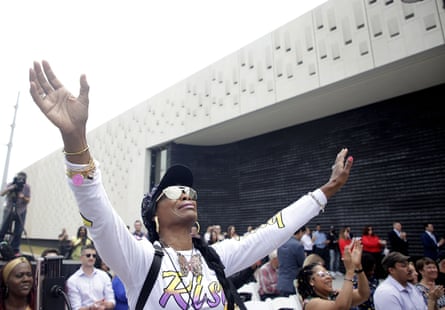 Chrisma Jewels reacts to music during a dedication ceremony for Greenwood Rising Black Wall Street History Center Wednesday, June 2, 2021 in Tulsa, Okla.