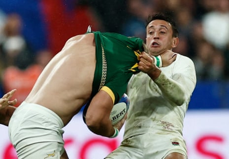 South Africa’s Kwagga Smith is tackled by England’s Alex Mitchell.