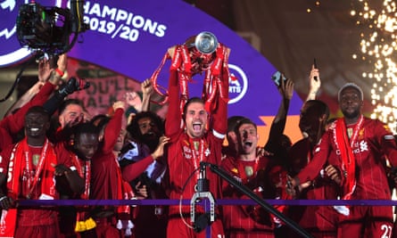 Jordan Henderson lifts the Premier League trophy in July.