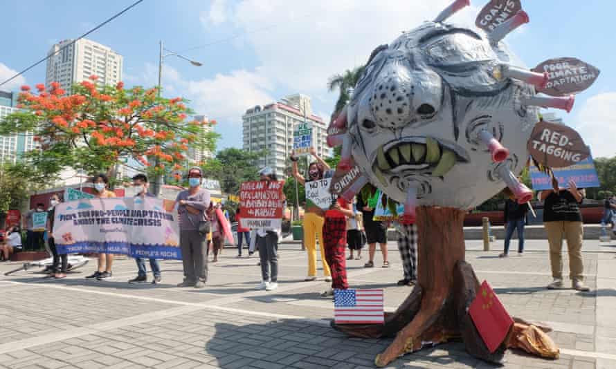 Protesters stand next to a two-metre effigy of president Rodgrigo Duterte in Manila, the Philippines, as part of the global climate strike on 24 September 2021