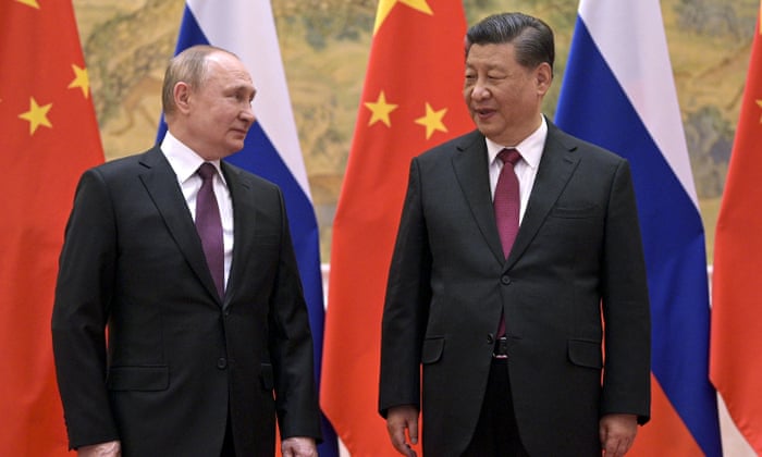 China’s president, Xi Jinping, talks to Vladimir Putin in Beijing in February.