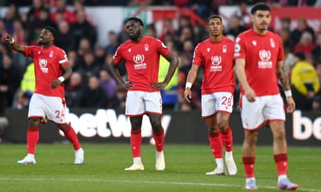 Nottingham Forest players look dejected after Facundo Buonanotte opened the scoring for Brighton.