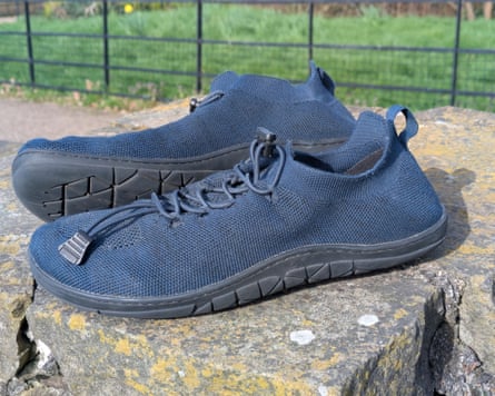A pair of navy Freet TangaII on a rock wall