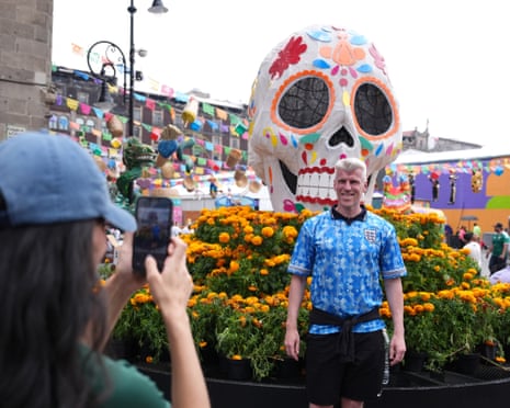 An England fan poses for a pictureat Plaza de la Constitucion, Mexico City.