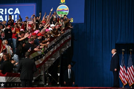 Trump looks up to the crowd during the rally in Park City