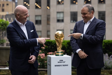 FBL-WC-2026-VENUESFIFA President Gianni Infantino (L) and CONCACAF President Victor Montagliani (R) pose with the FIFA World Cup trophy during an event in New York after an announcement related to the staging of the FIFA World Cup 2026, on June 16, 2022. Mexico City's iconic Azteca Stadium and the Los Angeles Rams' multi-billion-dollar SoFi Stadium were among 16 venues named on June 16 to stage games at the 2026 World Cup being held in the United States, Canada and Mexico. (Photo by Yuki IWAMURA / AFP via Getty Images)