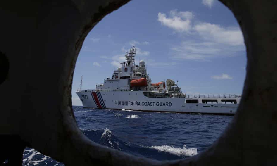 A Chinese Coast Guard ship attempts to block a Philippine government vessel as it tried to enter Second Thomas Shoal in the South China Sea in 2014. 