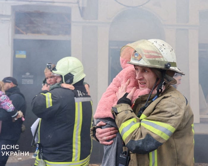 Ukraine kindergarten among civilian sites hit by Russian drone and missile strikes – video