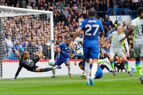 Chelsea's goalkeeper Robert Sanchez saves in front of Manchester City’s Bernardo Silva.