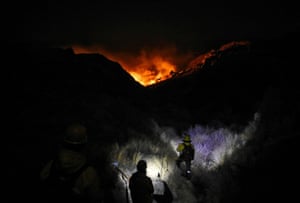 Firefighters attempt to get a blaze under control at the Parque Nacional Quebrada del Condorito